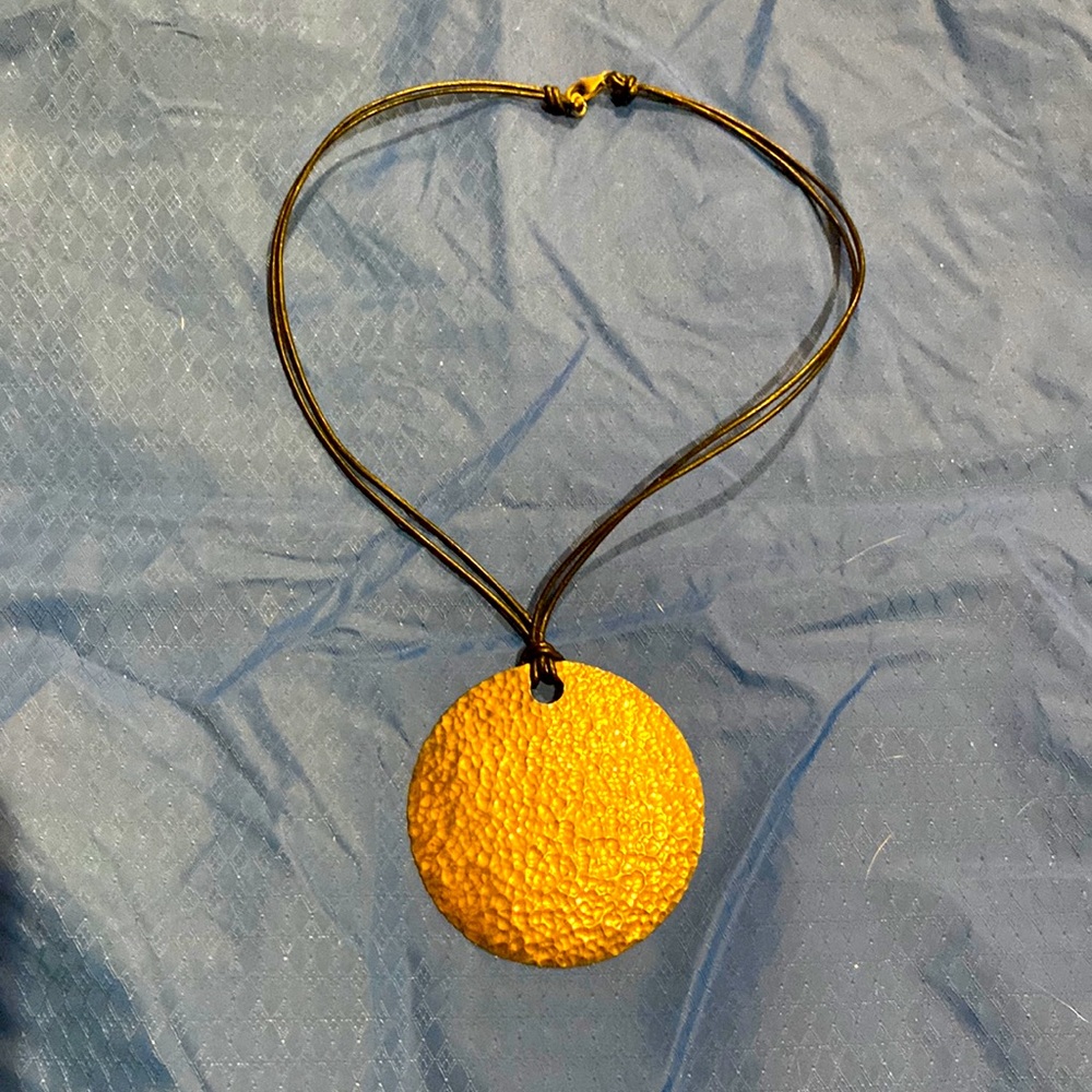 Necklace with round silver medallion